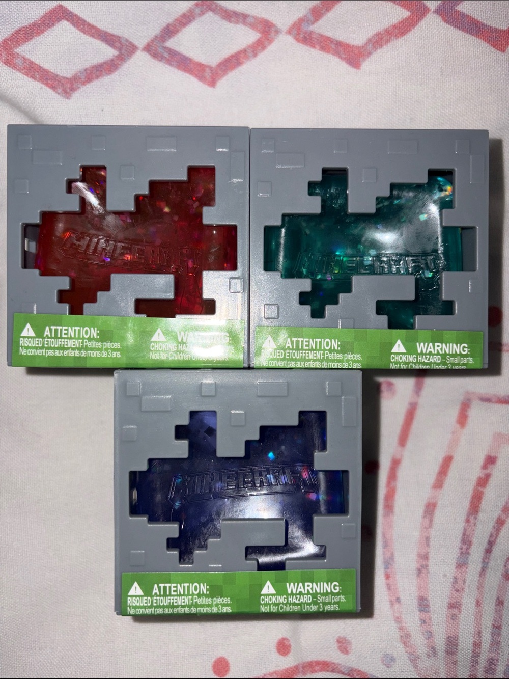 1 Minecraft squishy cube - Red, Teal, and Purple
